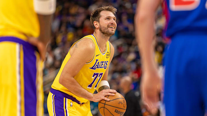 Mar 23, 2026; Detroit, Michigan, USA; Los Angeles Lakers Luka Doncic (77) shoots a free throw against the Detroit Pistons during the first quarter at Little Caesars Arena. Mandatory Credit: David Reginek-Imagn Images