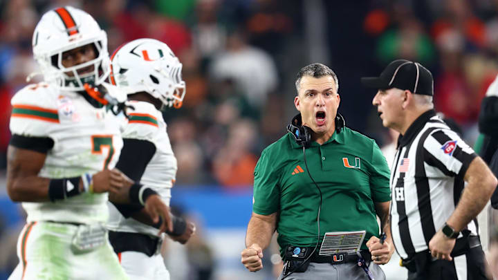 Jan 8, 2026; Glendale, AZ, USA; Miami Hurricanes head coach Mario Cristobal reacts in the second half during the 2026 Fiesta Bowl and semifinal game of the College Football Playoff at State Farm Stadium. Mandatory Credit: Mark J. Rebilas-Imagn Images