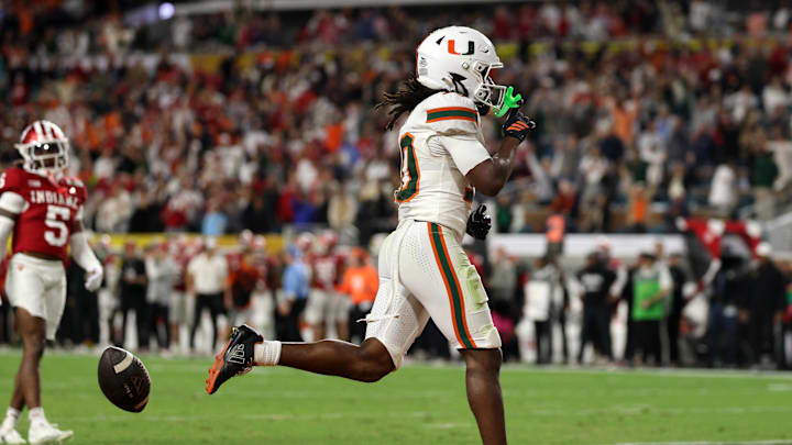 Jan 19, 2026; Miami Gardens, FL, USA; Miami Hurricanes wide receiver Malachi Toney (10) rushes the ball for a touchdown against the Indiana Hoosiers in the second half during the College Football Playoff National Championship game at Hard Rock Stadium. Mandatory Credit: Nathan Ray Seebeck-Imagn Images