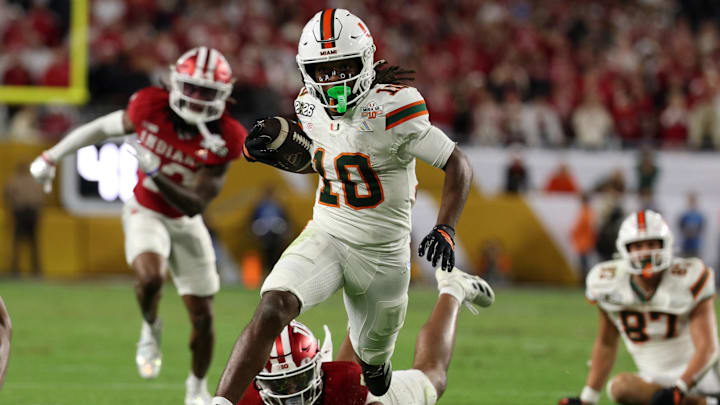 Jan 19, 2026; Miami Gardens, FL, USA; Miami Hurricanes wide receiver Malachi Toney (10) rushes the ball for a touchdown against the Indiana Hoosiers in the second half during the College Football Playoff National Championship game at Hard Rock Stadium. Mandatory Credit: Nathan Ray Seebeck-Imagn Images