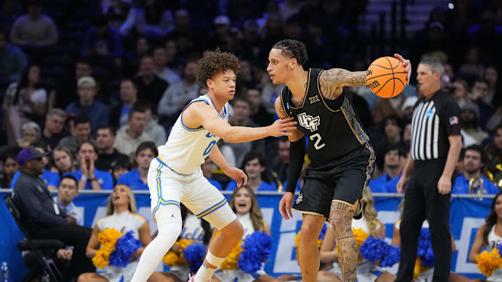 Mar 20, 2026; Philadelphia, PA, USA; UCF Knights guard Riley Kugel (2) dribbles the ball against UCLA Bruins guard Trent Perry (0) in the first half during a first round game of the men's 2026 NCAA Tournament at Xfinity Mobile Arena. Mandatory Credit: Kyle Ross-Imagn Images Mar 20, 2026; Philadelphia, PA, USA; UCF Knights guard Riley Kugel (2) dribbles the ball against UCLA Bruins guard Trent Perry (0) in the first half during a first round game of the men's 2026 NCAA Tournament at Xfinity Mobile Arena. Mandatory Credit: Kyle Ross-Imagn Images
