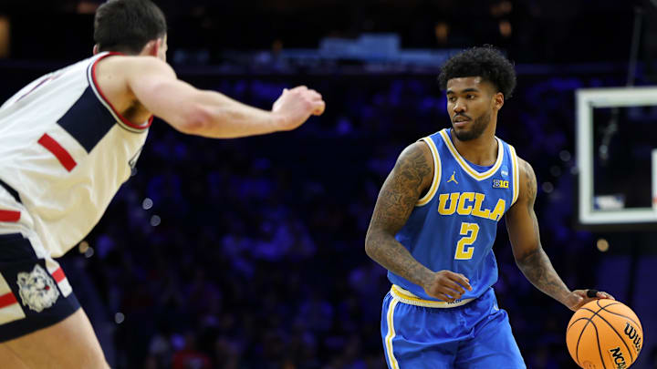 Mar 22, 2026; Philadelphia, PA, USA; UCLA Bruins guard Donovan Dent (2) dribbles the ball against the UConn Huskies in the second half during a second round game of the men's 2026 NCAA Tournament at Xfinity Mobile Arena. Mandatory Credit: Bill Streicher-Imagn Images