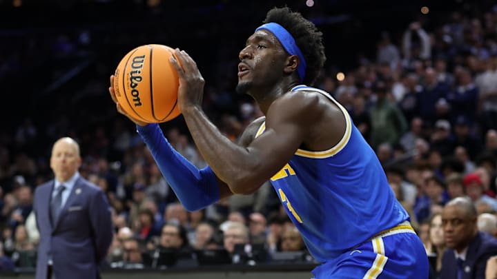 Mar 22, 2026; Philadelphia, PA, USA; UCLA Bruins forward Eric Dailey Jr. (3) shoots the ball against the UConn Huskies in the second half during a second round game of the men's 2026 NCAA Tournament at Xfinity Mobile Arena. Mandatory Credit: Bill Streicher-Imagn Images