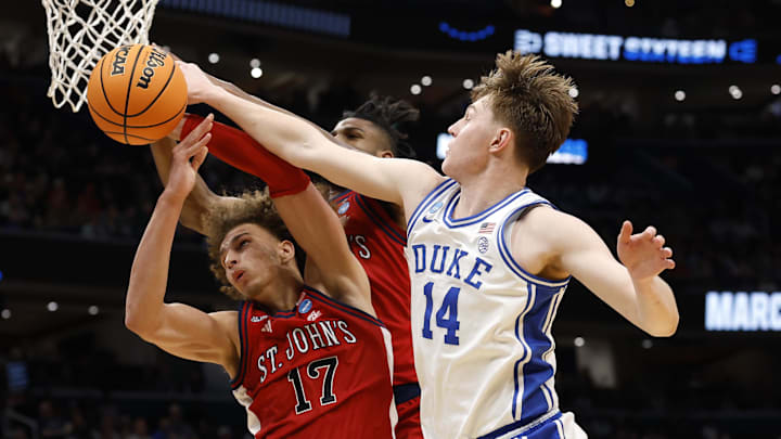 Mar 27, 2026; Washington, DC, USA; Duke Blue Devils guard Nikolas Khamenia (14) blocks the shot of St. John's Red Storm forward Rubén Prey (17) in the first half during a Sweet Sixteen game of the East Regional of the men's 2026 NCAA Tournament at Capital One Arena. Mandatory Credit: Geoff Burke-Imagn Images
