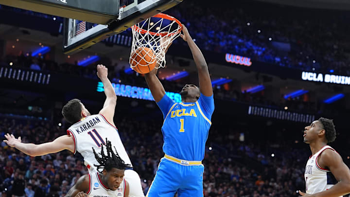 Mar 22, 2026; Philadelphia, PA, USA; UCLA Bruins center Xavier Booker (1) dunks the ball against the UConn Huskies in the first half during a second round game of the men's 2026 NCAA Tournament at Xfinity Mobile Arena. Mandatory Credit: Kyle Ross-Imagn Images
