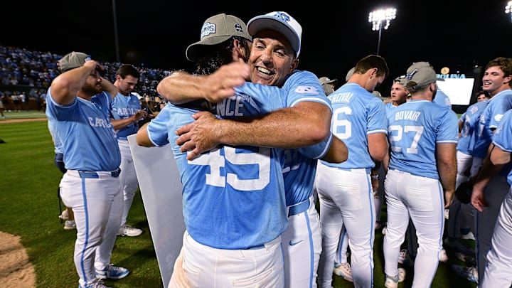 Jun 8, 2024; Chapel Hill, NC, USA; North Carolina Tar Heels pitcher Dalton Pence (49) head coach Scott Forbes (21) hug after winning the DI Baseball Super Regional over the West Virginia Mountaineers at Boshamer Stadium. Mandatory Credit: Jeffrey Camarati-USA TODAY Sports

