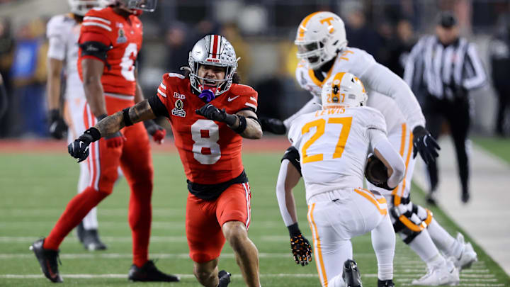 Dec 21, 2024; Columbus, Ohio, USA;  Ohio State Buckeyes safety Lathan Ransom (8) celebrates his third down tackle during the third quarter against the Tennessee Volunteers at Ohio Stadium. Mandatory Credit: Joseph Maiorana-Imagn Images