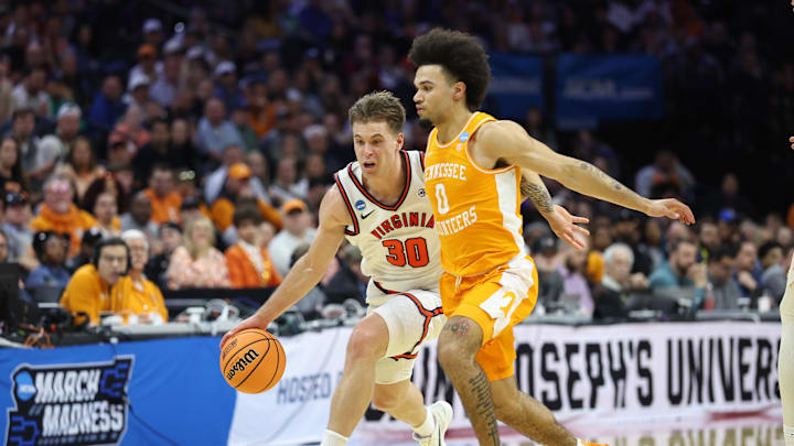 Mar 22, 2026; Philadelphia, PA, USA; Virginia Cavaliers guard Dallin Hall (30) dribbles the ball againstTennessee Volunteers guard Ja'kobi Gillespie (0) in the second half during a second round game of the men's 2026 NCAA Tournament at Xfinity Mobile Arena. Mandatory Credit: Bill Streicher-Imagn Images