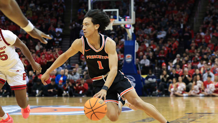 Dec 21, 2024; Newark, New Jersey, USA; Princeton Tigers guard Xaivian Lee (1) drives to the net against the Rutgers Scarlet Knights during the second half at Prudential Center. Mandatory Credit: Tom Horak-Imagn Images