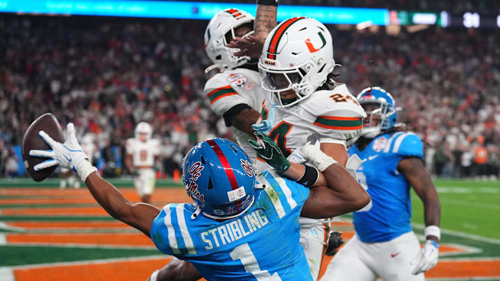 Jan 8, 2026; Glendale, AZ, USA; Mississippi Rebels wide receiver De'zhaun Stribling (1) attempts to make a catch against Miami Hurricanes defensive back Ethan O'Connor (24) in the second half during the 2026 Fiesta Bowl and semifinal game of the College Football Playoff at State Farm Stadium. Mandatory Credit: Joe Camporeale-Imagn Images Jan 8, 2026; Glendale, AZ, USA; Mississippi Rebels wide receiver De'zhaun Stribling (1) attempts to make a catch against Miami Hurricanes defensive back Ethan O'Connor (24) in the second half during the 2026 Fiesta Bowl and semifinal game of the College Football Playoff at State Farm Stadium. Mandatory Credit: Joe Camporeale-Imagn Images