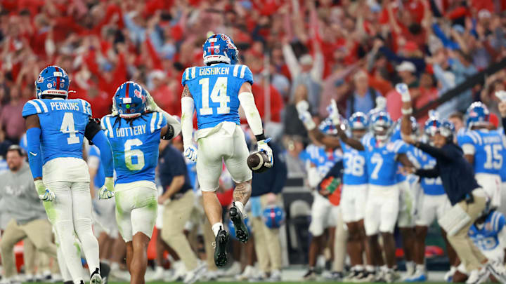 Jan 8, 2026; Glendale, AZ, USA; Mississippi Rebels safety Kapena Gushiken (14) reacts after making an interception against the Miami Hurricanes in the second half during the 2026 Fiesta Bowl and semifinal game of the College Football Playoff at State Farm Stadium. Mandatory Credit: Mark J. Rebilas-Imagn Images