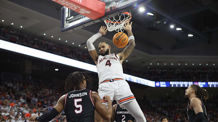 Feb 14, 2024; Auburn, Alabama, USA; Auburn Tigers forward Johni Broome (4) makes a dunk against the