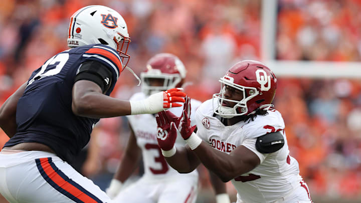 Sep 28, 2024; Auburn, Alabama, USA;  Oklahoma Sooners defensive lineman R Mason Thomas (32) moves in to block Auburn Tigers offensive lineman Izavion Miller (72) during the third quarter at Jordan-Hare Stadium. Mandatory Credit: John Reed-Imagn Images