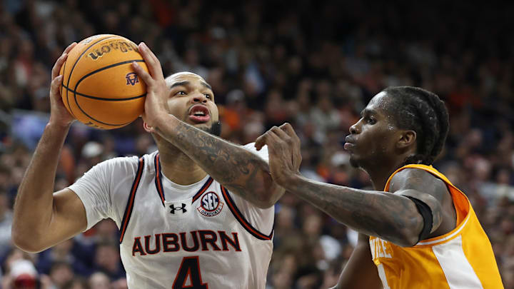 Jan 25, 2025; Auburn, Alabama, USA;  Tennessee Volunteers forward Felix Okpara (34) blocks Auburn Tigers forward Johni Broome (4) during the second half at Neville Arena. Mandatory Credit: John Reed-Imagn Images
