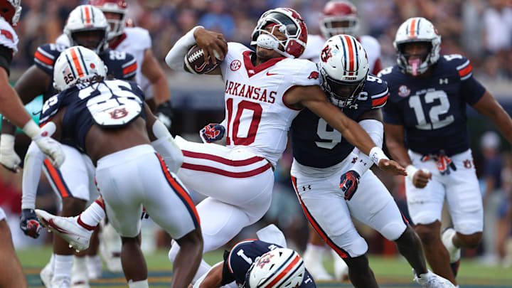 Sep 21, 2024; Auburn, Alabama, USA;  Arkansas Razorbacks quarterback Taylen Green (10) is tackled by Auburn Tigers linebacker Eugene Asante (9) during the first quarter at Jordan-Hare Stadium. Mandatory Credit: John Reed-Imagn Images