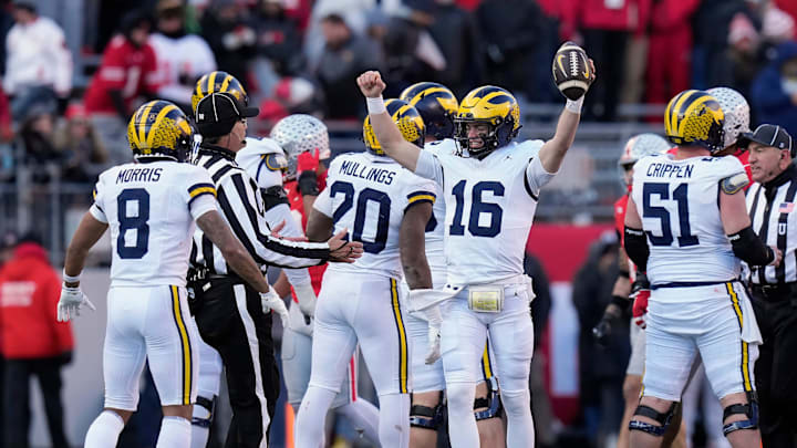 Michigan Wolverines quarterback Davis Warren (16) celebrates a 13-10 win over Ohio State Buckeyes at the end of the NCAA football game at Ohio Stadium in Columbus on Saturday, Nov. 30, 2024.