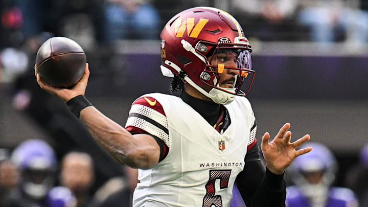 Dec 7, 2025; Minneapolis, Minnesota, USA; Washington Commanders quarterback Jayden Daniels (5) drops back to pass against the Minnesota Vikings during the first half at U.S. Bank Stadium. Mandatory Credit: Jeffrey Becker-Imagn Images
