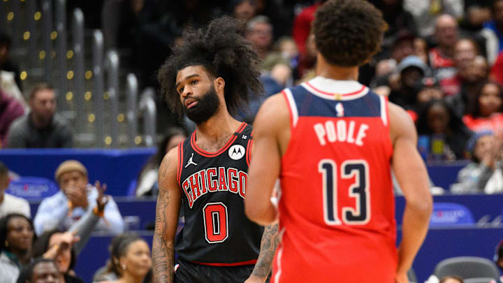 Jan 1, 2025; Washington, District of Columbia, USA; Chicago Bulls guard Coby White (0) reacts after Washington Wizards guard Jordan Poole (13) makes a field goal during the fourth quarter at Capital One Arena. Mandatory Credit: Reggie Hildred-Imagn Images