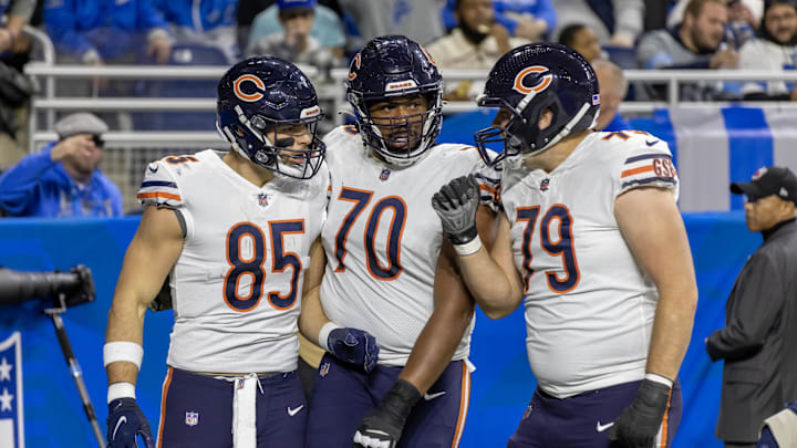 Jan 1, 2023; Detroit, Michigan, USA; Chicago Bears tight end Cole Kmet (85) celebrates his  touchdown against the Detroit Lions with tackle Braxton Jones (70) and guard Michael Schofield III (79) during the first quarter at Ford Field. Mandatory Credit: David Reginek-Imagn Images