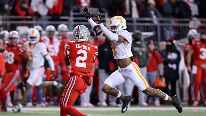Dec 21, 2024; Columbus, Ohio, USA;  Ohio State Buckeyes wide receiver Emeka Egbuka (2) catches a long pass as Tennessee Volunteers defensive back Jakobe Thomas (9) defends during the first quarter at Ohio Stadium. Mandatory Credit: Joseph Maiorana-Imagn Images