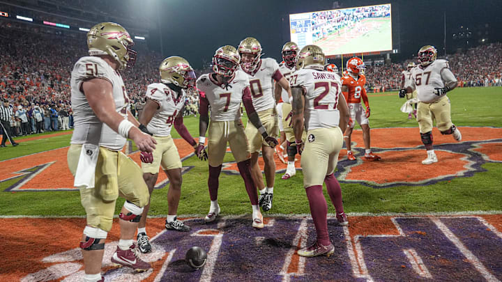 Nov 8, 2025; Clemson, South Carolina, USA; Florida State Seminoles receiver Lawayne McCoy (7) celebrates with teammates after scoring against the Clemson Tigers during the second quarter at Memorial Stadium. Mandatory Credit: Ken Ruinard - GREENVILLE NEWS-USA TODAY Network via Imagn Images