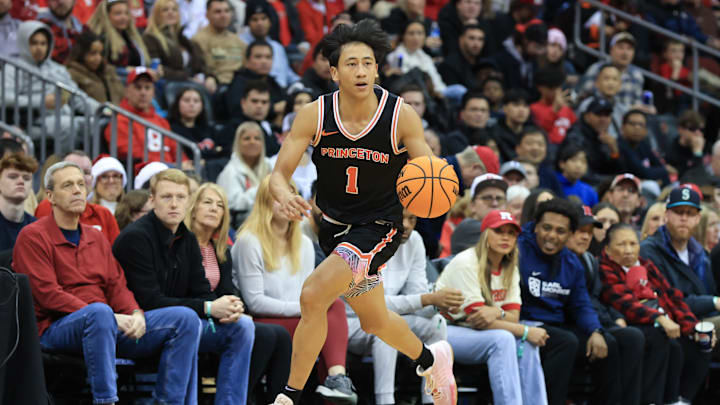 Dec 21, 2024; Newark, New Jersey, USA; St. John's basketball transfer target Xaivian Lee (1) dribbles the ball against the Rutgers Scarlet Knights during the second half at Prudential Center. Mandatory Credit: Tom Horak-Imagn Images