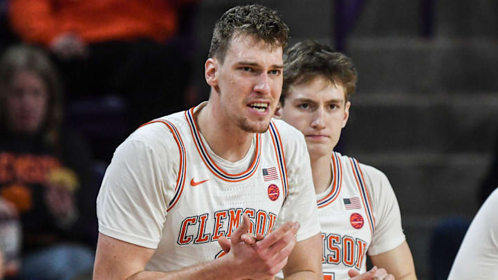 Clemson sophomore center Viktor Lakhin (0) claps from the bench with Clemson forward Asa Thomas (5) during the first half at Littlejohn Coliseum in Clemson, S.C Saturday, January 11, 2025.