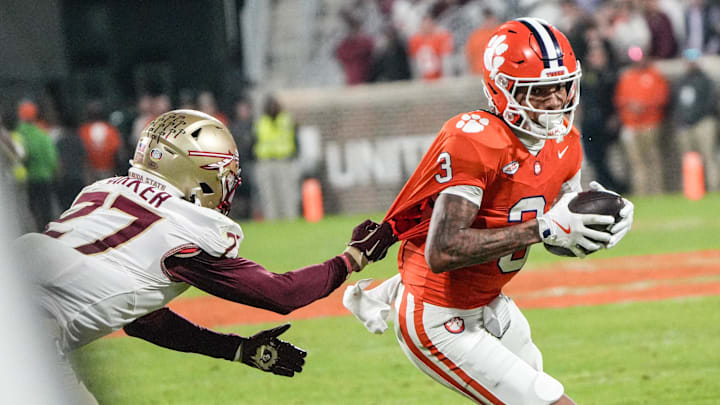 Nov 8, 2025; Clemson, South Carolina, USA; Florida State Seminoles defensive back Ashlynd Barker (27) tackles Clemson Tigers wide receiver Tristan Smith (3) during the second quarter at Memorial Stadium. Mandatory Credit: Ken Ruinard - GREENVILLE NEWS-USA TODAY Network via Imagn Images Nov 8, 2025; Clemson, South Carolina, USA; Florida State Seminoles defensive back Ashlynd Barker (27) tackles Clemson Tigers wide receiver Tristan Smith (3) during the second quarter at Memorial Stadium. Mandatory Credit: Ken Ruinard - GREENVILLE NEWS-USA TODAY Network via Imagn Images