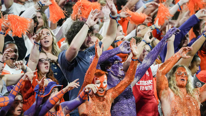 Nov 8, 2025; Clemson, South Carolina, USA; Clemson Tigers fans dance to the music of Miley Cyrus’ “Party in the U.S.A.” during the second quarter of the game against the Florida State Seminoles at Memorial Stadium. Mandatory Credit: Ken Ruinard - GREENVILLE NEWS-USA TODAY Network via Imagn Images Nov 8, 2025; Clemson, South Carolina, USA; Clemson Tigers fans dance to the music of Miley Cyrus’ “Party in the U.S.A.” during the second quarter of the game against the Florida State Seminoles at Memorial Stadium. Mandatory Credit: Ken Ruinard - GREENVILLE NEWS-USA TODAY Network via Imagn Images