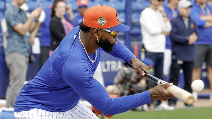 Feb 17, 2026; Port St. Lucie, FL, USA;  New York Mets outfielder Luis Robert Jr. (88) bunts the ball during the New York Mets spring training workouts at Clover Park. Mandatory Credit: Reinhold Matay-Imagn Images