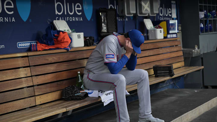 Apr 13, 2026; Los Angeles, California, USA; New York Mets pitcher David Peterson (23) sits in the dug out before the game against the Los Angeles Dodgers at Dodger Stadium. Mandatory Credit: Jayne Kamin-Oncea-Imagn Images