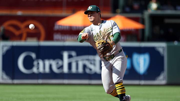 Aug 10, 2025; Baltimore, Maryland, USA; Athletics second baseman Luis Urias (17) throws to first for an out during the ninth inning against the Baltimore Orioles at Oriole Park at Camden Yards. Mandatory Credit: Daniel Kucin Jr.-Imagn Images