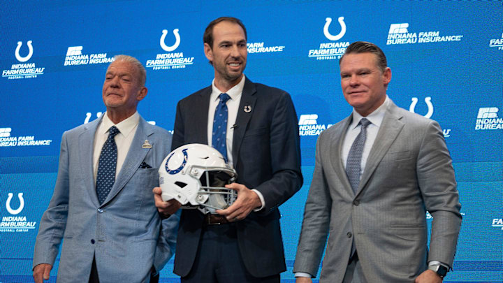 Shane Steichen, center, poses for photos with Colts Owner and CEO Jim Irsay, left, and General