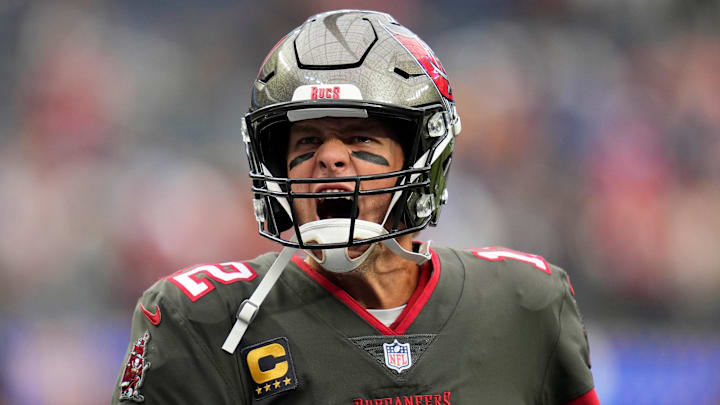 Sep 26, 2021; Inglewood, California, USA; Tampa Bay Buccaneers quarterback Tom Brady (12) yells at Bucs fans as he takes the field for pregame warmups before playing the Los Angeles Rams. Mandatory Credit: Robert Hanashiro-Imagn Images