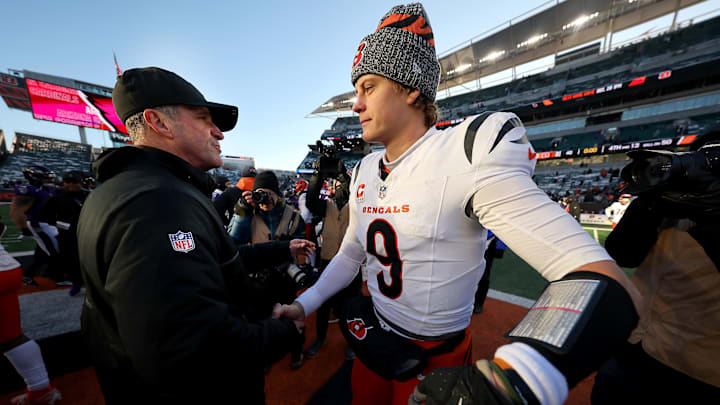 Dec 14, 2025; Cincinnati, Ohio, USA; Cincinnati Bengals quarterback Joe Burrow (9) and Baltimore Ravens head coach John Harbaugh meet after the game at Paycor Stadium. Mandatory Credit: Joseph Maiorana-Imagn Images Dec 14, 2025; Cincinnati, Ohio, USA; Cincinnati Bengals quarterback Joe Burrow (9) and Baltimore Ravens head coach John Harbaugh meet after the game at Paycor Stadium. Mandatory Credit: Joseph Maiorana-Imagn Images