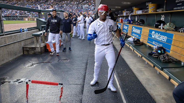  Detroit Tigers second baseman Andy Ibanez (77) celebrates in the dugout after hitting a home run.