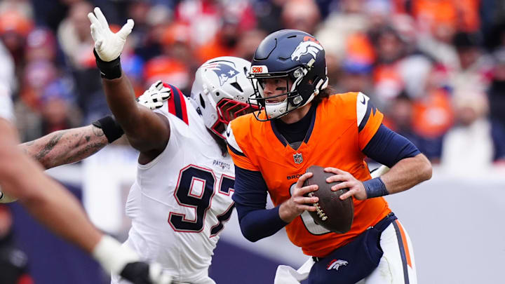 Jan 25, 2026; Denver, CO, USA; Denver Broncos quarterback Jarrett Stidham (8) drops back to pass against the New England Patriots during the first half in the 2026 AFC Championship Game at Empower Field at Mile High. Mandatory Credit: Ron Chenoy-Imagn Images