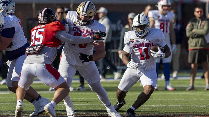 Jan 28, 2026; Mobile, AL, USA; National Team running back Kaytron Allen (11) of Penn State runs the ball with National Team offensive lineman Carver Willis (75) of Washington blocking during National Senior Bowl practice at Hancock Whitney Stadium. Mandatory Credit: Vasha Hunt-Imagn Images