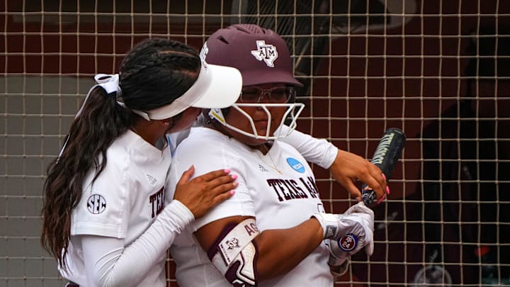 Texas A&M infielder Sav Price (16) gives tips to infielder Mya Perez (24) during the NCAA Super Regional opener against Texas A&M at Red & Charline McCombs Field on Friday, May 24, 2024 in Austin.