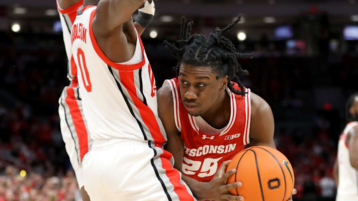 Jan 10, 2024; Columbus, Ohio, USA; Wisconsin Badgers guard John Blackwell (25) looks for the shot as Ohio State Buckeyes guard Scotty Middleton (0) defends during the first half at Value City Arena. Jan 10, 2024; Columbus, Ohio, USA; Wisconsin Badgers guard John Blackwell (25) looks for the shot as Ohio State Buckeyes guard Scotty Middleton (0) defends during the first half at Value City Arena.