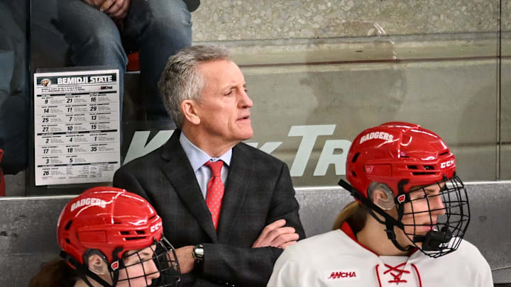 Wisconsin Badgers head coach Mark Johnson and players watch the action in the second period of a WCHA first-round game against the Bemidji State Beavers on Saturday, March 1, 2025, at LaBahn Arena in Madison, Wisconsin.