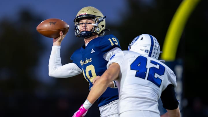 Tri-West Hendricks High School junior Jack Sorgi (19) is pressured in the backfield by Bishop Chatard High School junior Cole Lunsford (42) during the first half of an IHSAA varsity football game, Friday, Oct. 10, 2025, at Tri-West Hendricks High School. Tri-West Hendricks High School junior Jack Sorgi (19) is pressured in the backfield by Bishop Chatard High School junior Cole Lunsford (42) during the first half of an IHSAA varsity football game, Friday, Oct. 10, 2025, at Tri-West Hendricks High School.