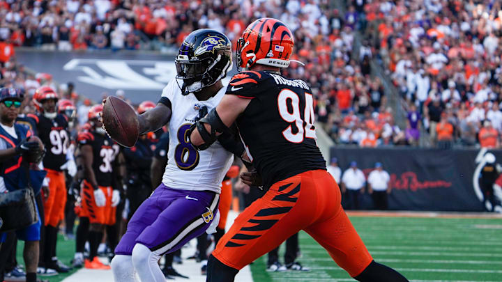 Cincinnati Bengals defensive end Sam Hubbard (94) pushes Baltimore Ravens quarterback Lamar Jackson (8) out of bounds during the 4th quarter Sunday October 6, 2024 at Payor Stadium.