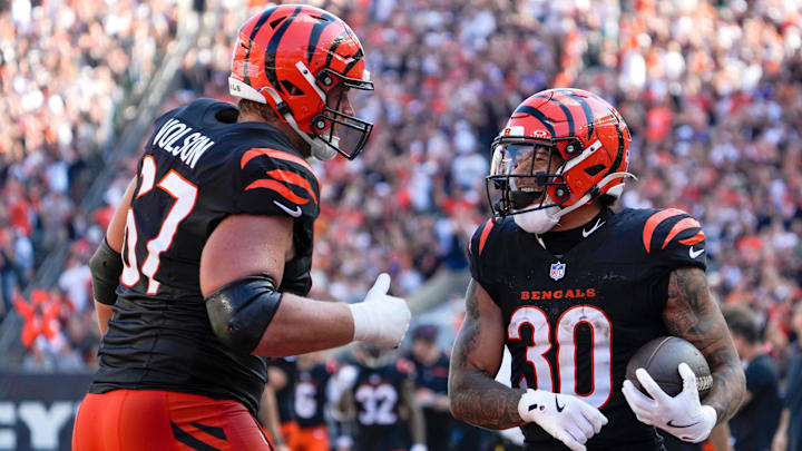 Cincinnati Bengals halfback Chase Brown (30) and guard Cordell Volson (67) celebrate Brown’s touchdown in the 4th quarter Sunday October 6, 2024 at Payor Stadium. The Bengals lost to Baltimore Ravens 41-38 in overtime.