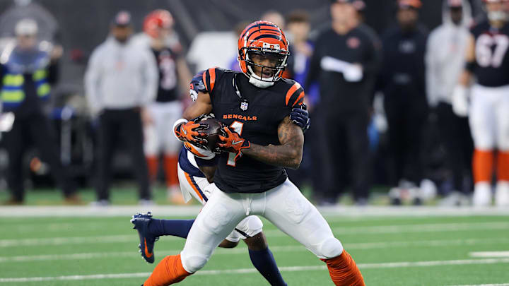 Dec 28, 2024; Cincinnati, Ohio, USA;  Cincinnati Bengals wide receiver Ja'Marr Chase (1) makes the catch during the second quarter against the Denver Broncos at Paycor Stadium. Mandatory Credit: Joseph Maiorana-Imagn Images
