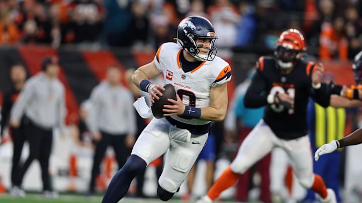 Dec 28, 2024; Cincinnati, Ohio, USA;  Denver Broncos quarterback Bo Nix (10) looks downfield during the first quarter against the Cincinnati Bengals at Paycor Stadium. Mandatory Credit: Joseph Maiorana-Imagn Images