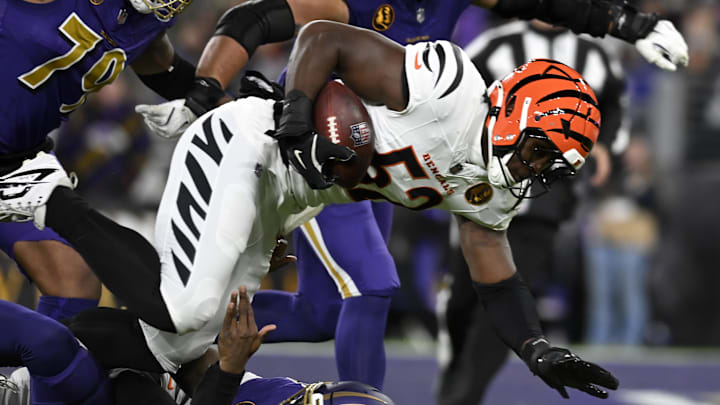 Nov 27, 2025; Baltimore, Maryland, USA; Cincinnati Bengals defensive end Cedric Johnson (52) recovers a fumble against the Baltimore Ravens during the first half at M&T Bank Stadium. Mandatory Credit: Tommy Gilligan-Imagn Images Nov 27, 2025; Baltimore, Maryland, USA; Cincinnati Bengals defensive end Cedric Johnson (52) recovers a fumble against the Baltimore Ravens during the first half at M&T Bank Stadium. Mandatory Credit: Tommy Gilligan-Imagn Images
