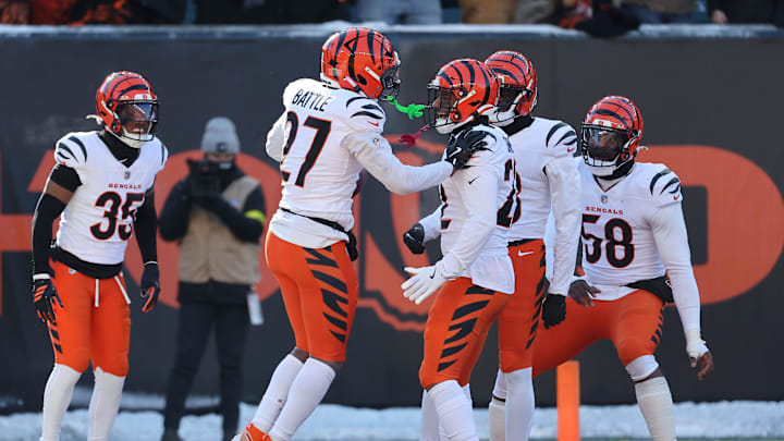 Dec 14, 2025; Cincinnati, Ohio, USA; Cincinnati Bengals safety Jordan Battle (27) celebrates his interception with teammates during the second quarter against the Baltimore Ravens at Paycor Stadium. Mandatory Credit: Joseph Maiorana-Imagn Images