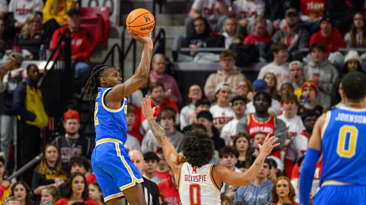 Jan 10, 2025; College Park, Maryland, USA; UCLA Bruins guard Dylan Andrews (2) takes a shot over Maryland Terrapins guard Ja'Kobi Gillespie (0) during the second half at Xfinity Center. Mandatory Credit: Reggie Hildred-Imagn Images