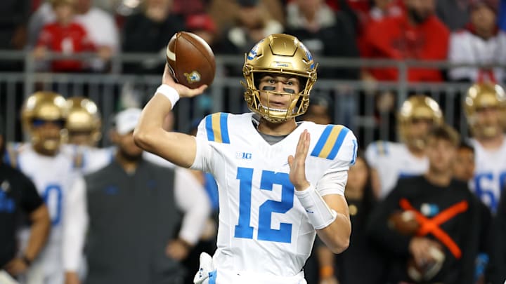 Nov 15, 2025; Columbus, Ohio, USA;  UCLA Bruins quarterback Luke Duncan (12) drops back to throw during the first quarter against the Ohio State Buckeyes at Ohio Stadium. Mandatory Credit: Joseph Maiorana-Imagn Images